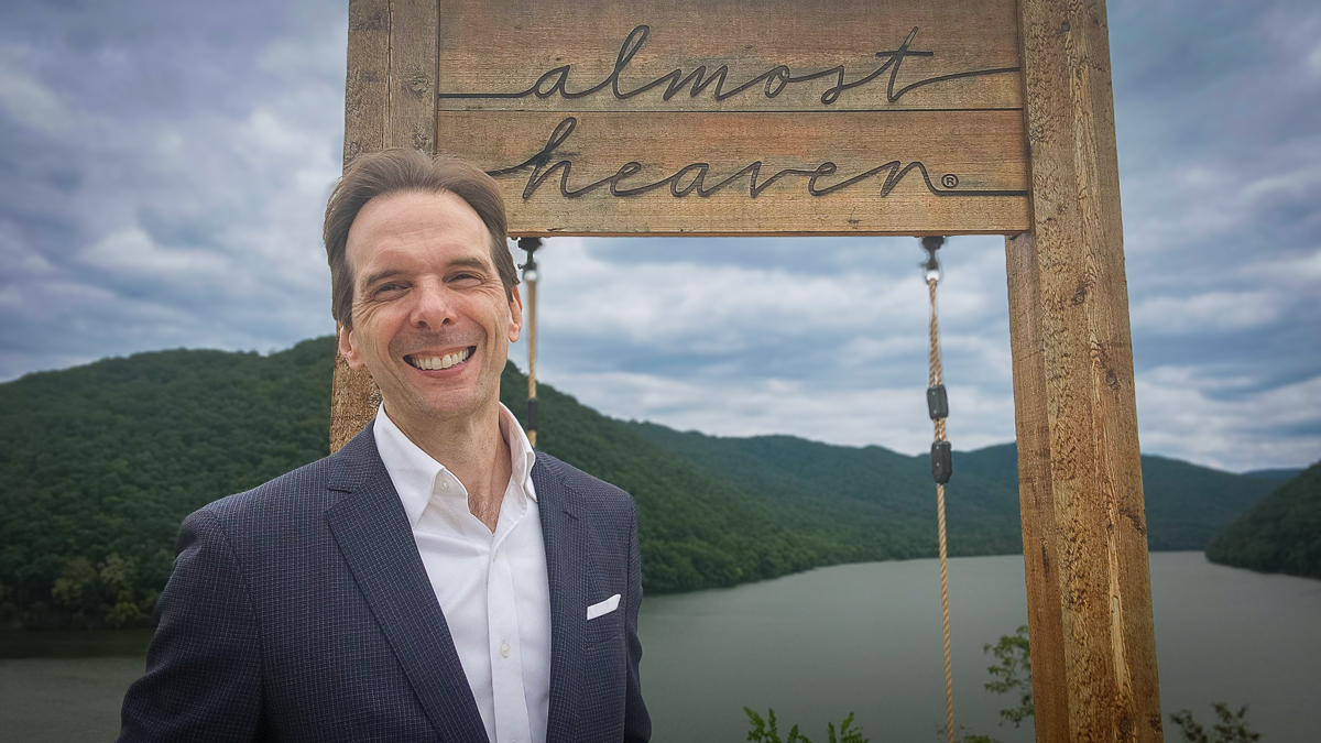 Motivational speaker Larry Weaver enjoying the Almost Heaven Swing at Bluestone State Park in West Virginia