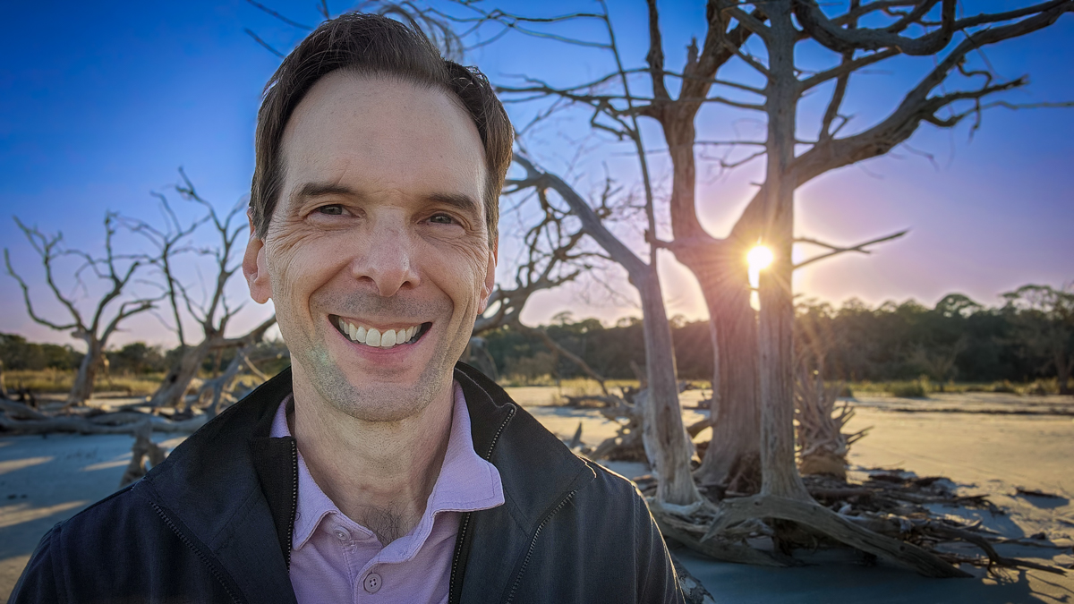 Motivational speaker Larry Weaver among the weathered trees at Driftwood Beach on Jekyll Island, Georgia