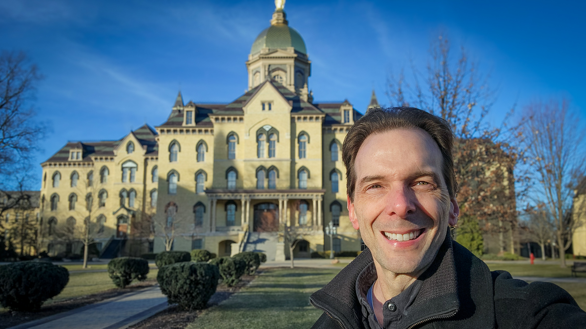 Motivational speaker Larry Weaver standing in front of the Golden Dome at the University of Notre Dame in Indiana