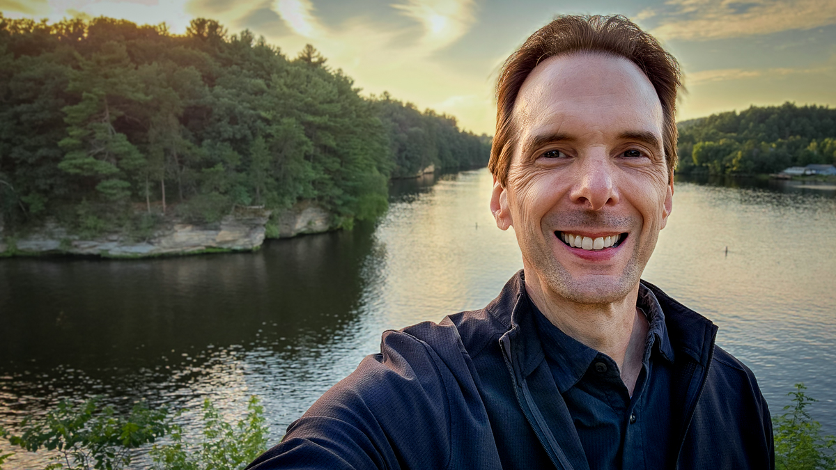 Motivational speaker Larry Weaver walking along the Scenic River Walk beside the Wisconsin River in Wisconsin Dells