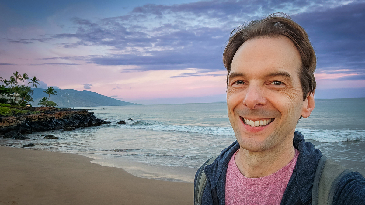 Motivational speaker Larry Weaver walking along the Wailea Beach Path at sunrise in Maui, Hawaii
