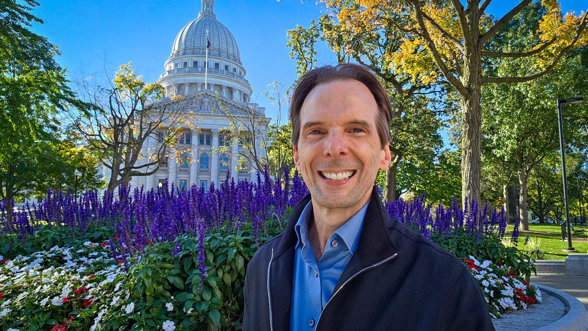 Motivational speaker Larry Weaver in front of the Wisconsin State Capitol building in Madison.
