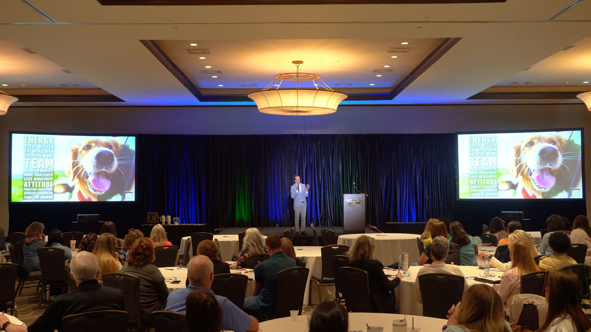Motivational keynote speaker Larry Weaver presenting to agricultural finance support professionals at the Marriott Myrtle Beach Resort at Grande Dunes