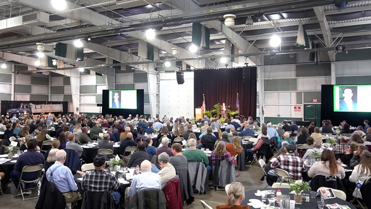 Larry Weaver speaking onstage for an agriculture recognition banquet at York Exposition Center in York, Pennsylvania.