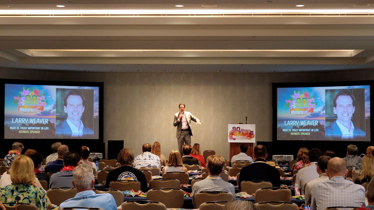 Larry Weaver speaking onstage for a confectionery industry conference at Wailea Beach Resort - Marriott, Maui in Maui, Hawaii.