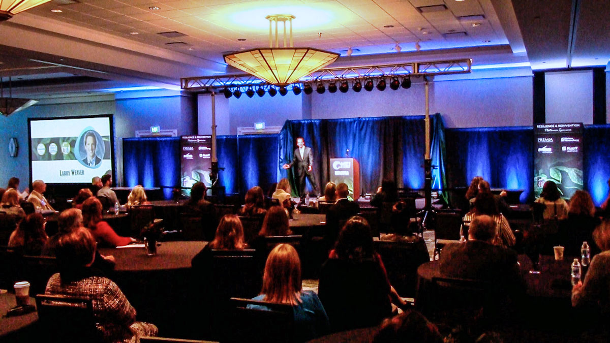 Motivational keynote speaker Larry Weaver presenting to global mobility and relocation professionals at Embassy Suites Omaha Downtown Old Market