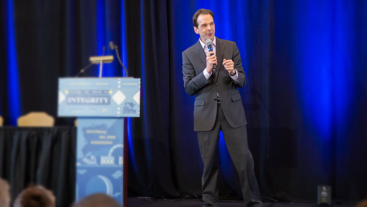 Motivational keynote speaker Larry Weaver engaging a live audience from the stage