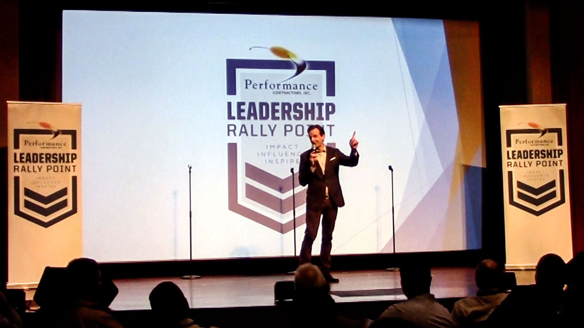 Motivational keynote speaker Larry Weaver engaging a live audience from the stage