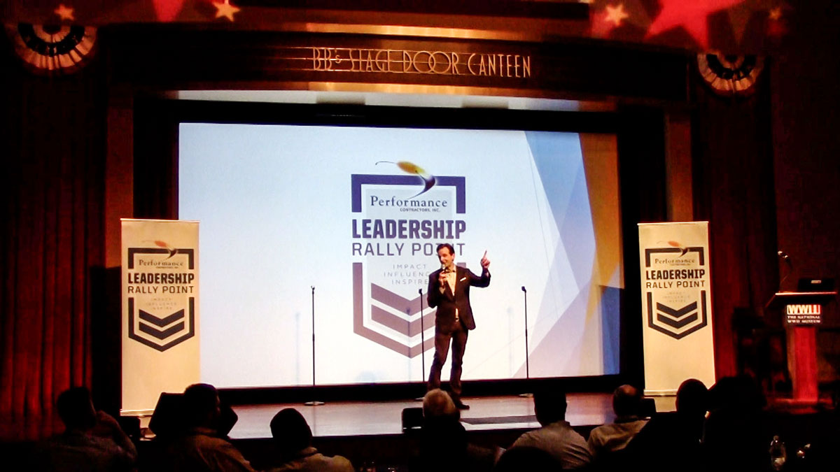 Motivational keynote speaker Larry Weaver presenting to construction industry leaders and military veterans at The National WWII Museum in New Orleans