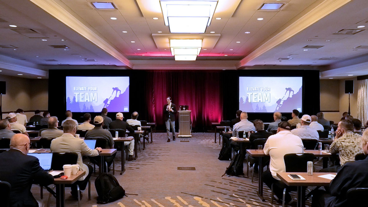 Motivational keynote speaker Larry Weaver presenting to power plant construction and energy industry professionals at The Woodlands Resort near Houston, Texas