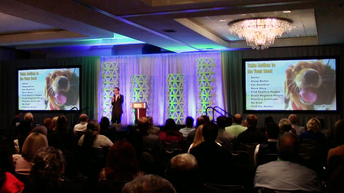 Larry Weaver speaking onstage for primary care professionals during a fall conference at Lexington Griffin Gate Marriott Golf Resort & Spa in Lexington, Kentucky.