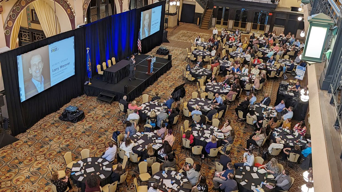 Motivational keynote speaker Larry Weaver presenting to state workforce agency professionals at Crowne Plaza Indianapolis Downtown Union Station